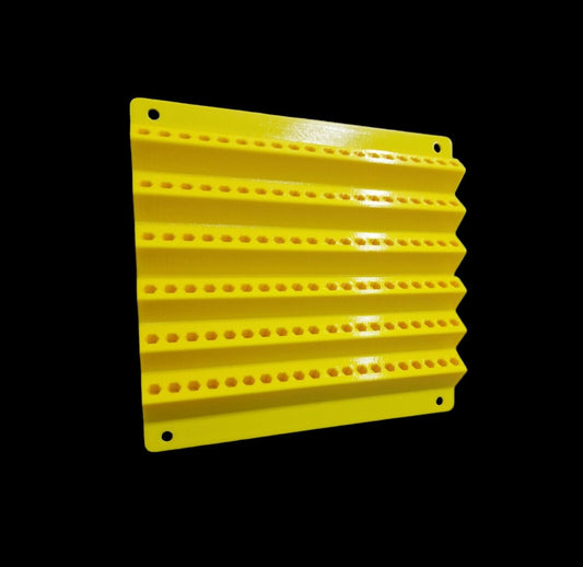 A durable, yellow rectangular screwdriver bit holder by Unbranded, featuring horizontal ridges and rows of small circular indentations, is designed to hold 120 hex shank bits measuring 6.35mm (1/4"). It includes four small holes in each corner for wall mounting and is set against a black background.